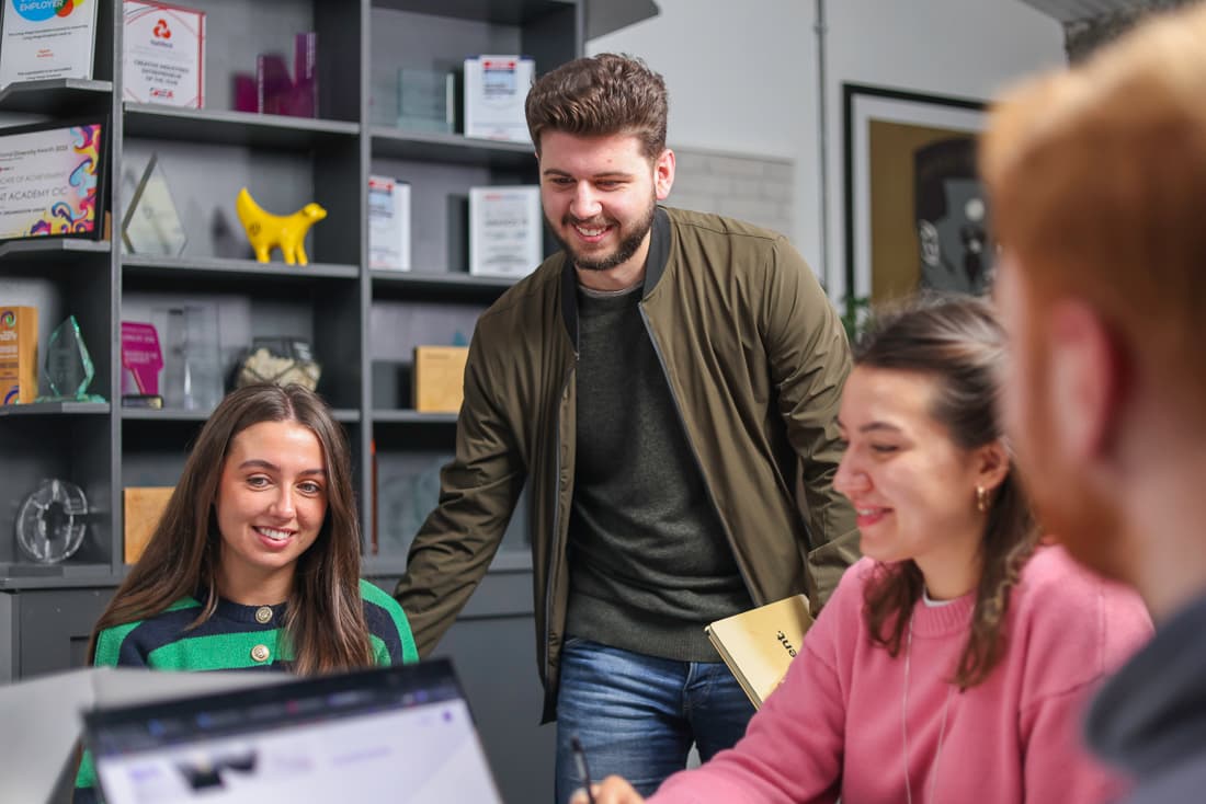 Josh standing over table